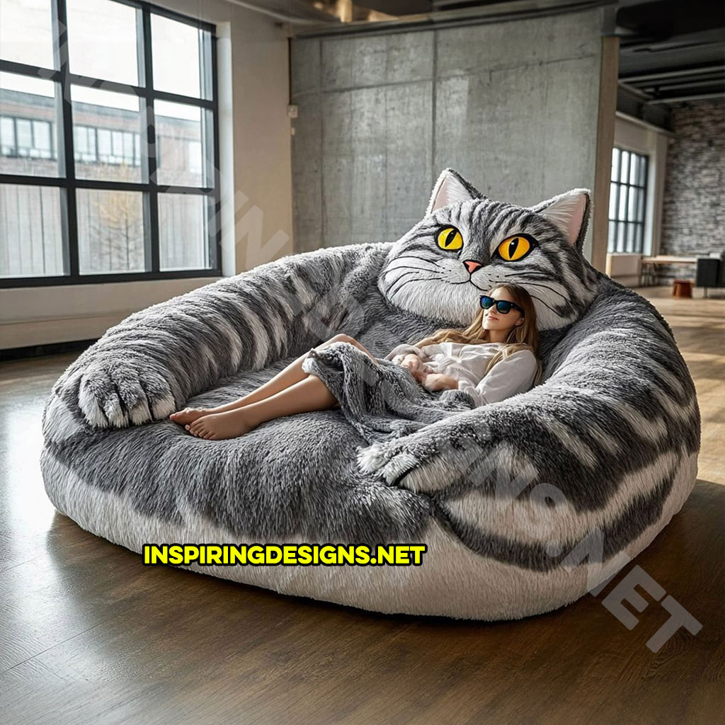 giant cat shaped lounger in a grey and white color palette